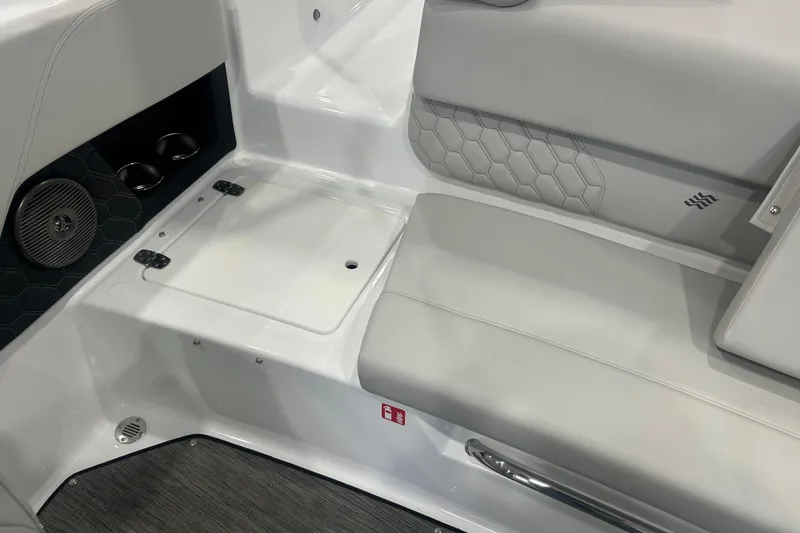 Slide: The Image of 2026 Four Winns H1 Freedom boat interior with gray seating and speaker. - 13