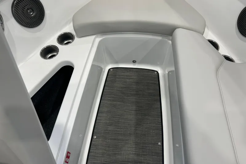 Slide: The Image of Interior of 2026 Four Winns H1 Freedom boat with seating and cup holders. - 15