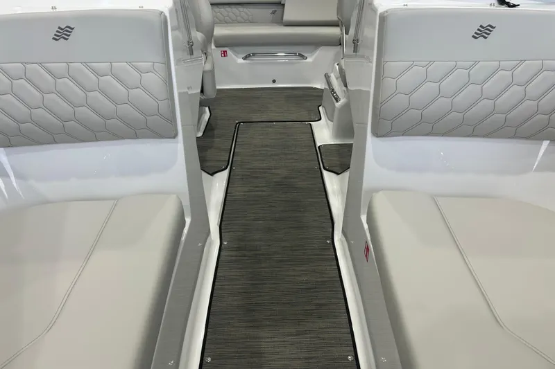 Slide: The Image of 2026 Four Winns H1 Freedom boat interior with sleek seating and modern design. - 16