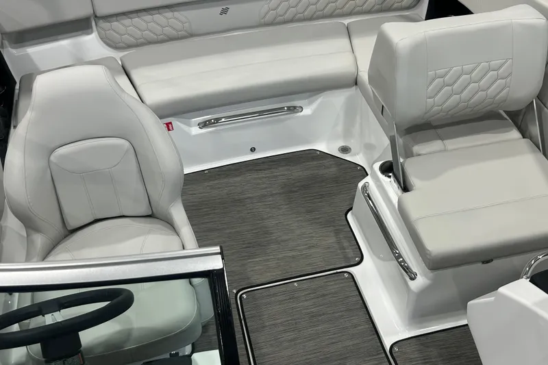 Slide: The Image of 2026 Four Winns H1 Freedom boat interior with modern seating and sleek design. - 23