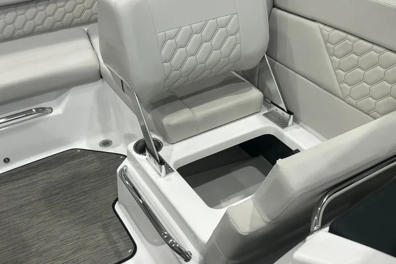 Slide: The Image of 2026 Four Winns H1 Freedom boat interior with stylish seating and storage compartment. - 25