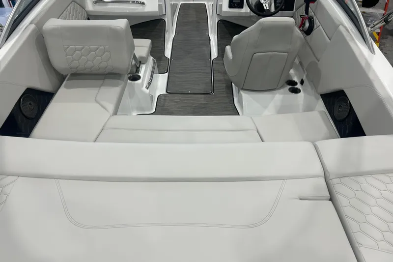 Slide: The Image of 2026 Four Winns H1 Freedom boat interior with sleek seating and modern design. - 9
