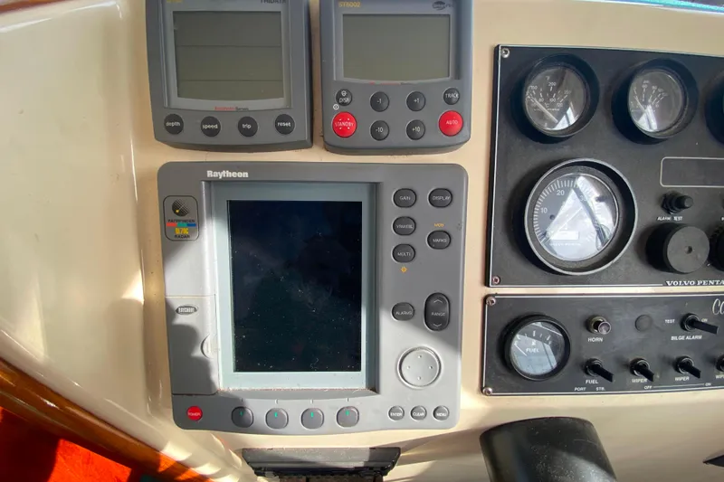 Slide: The Image of Camano 30 boat dashboard with Raytheon radar and Volvo Penta gauges. - 10