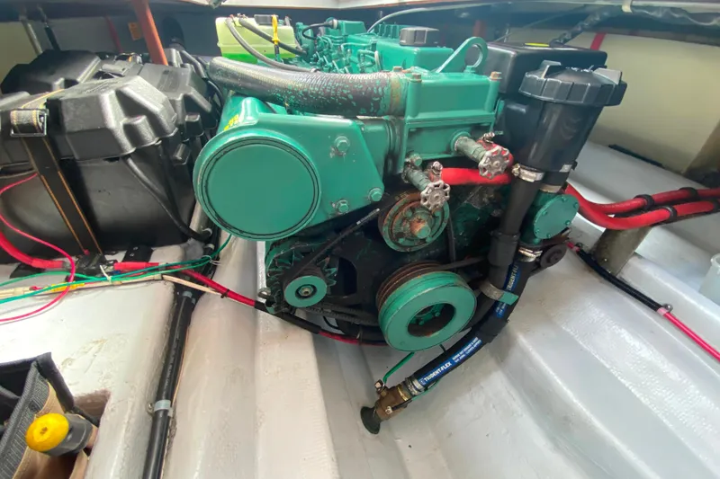 Slide: The Image of Engine compartment of a Camano 30 boat with visible wiring and components. - 29
