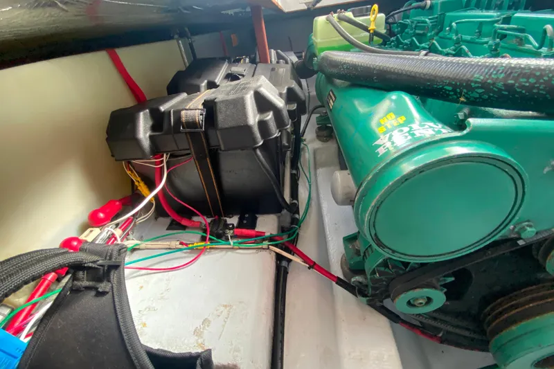 Slide: The Image of Engine compartment of Camano 30 boat with wiring and battery box. - 31