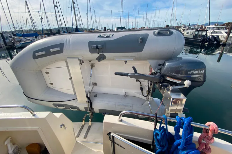 Slide: The Image of Camano 30 boat with Yamaha outboard motor and inflatable dinghy at marina. - 41