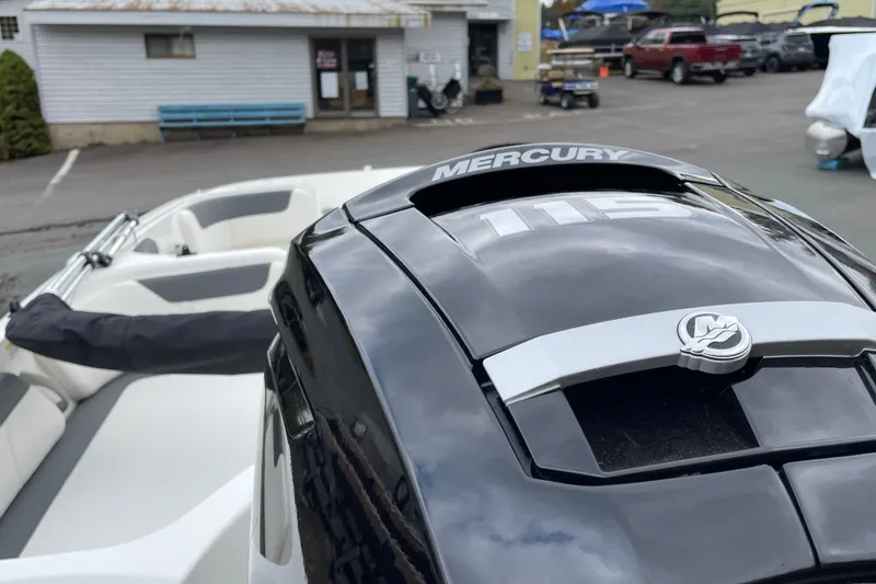 Slide: The Image of 2026 Bayliner Element E18 with Mercury 115 engine in a marina setting. - 5