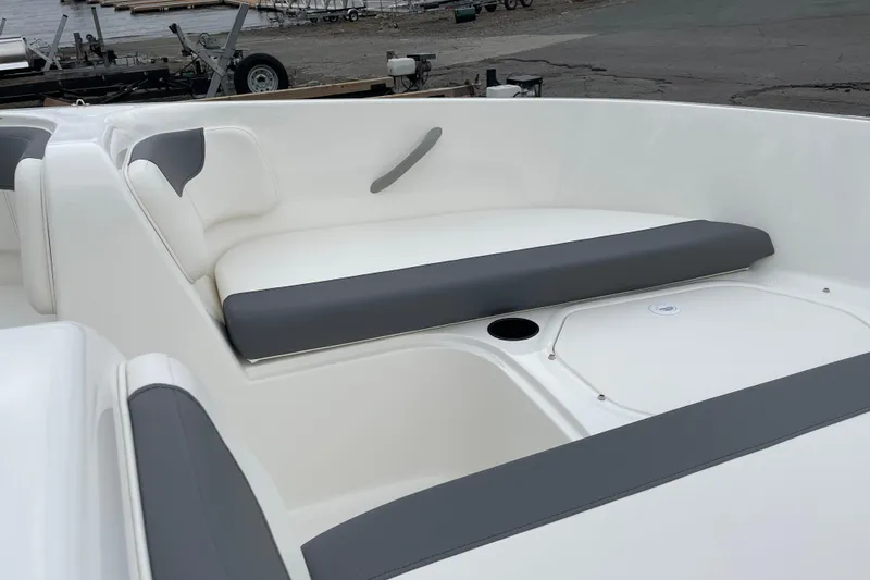 Slide: The Image of 2026 Bayliner Element E18 boat interior with white and gray seating. - 8