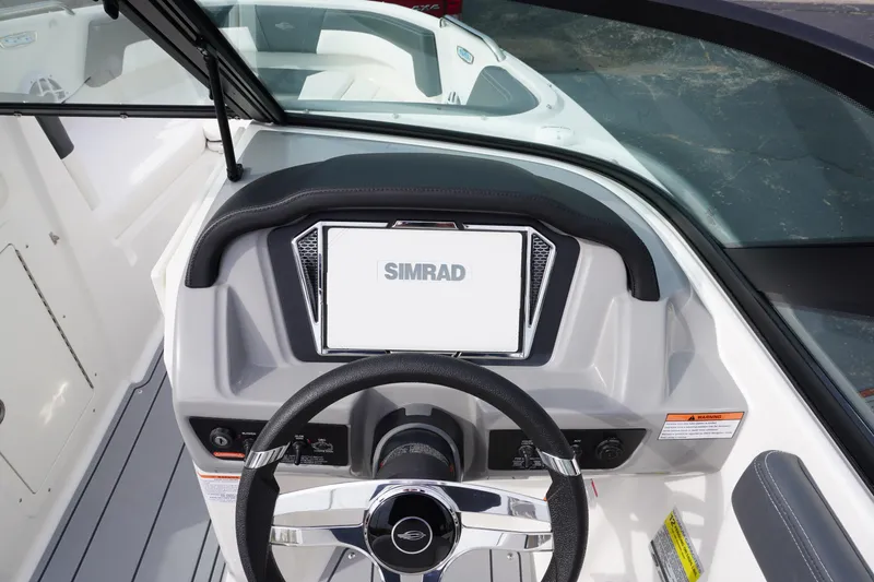 Slide: The Image of 2026 Chaparral 21 SSi Ski & Fish boat dashboard with Simrad display. - 12