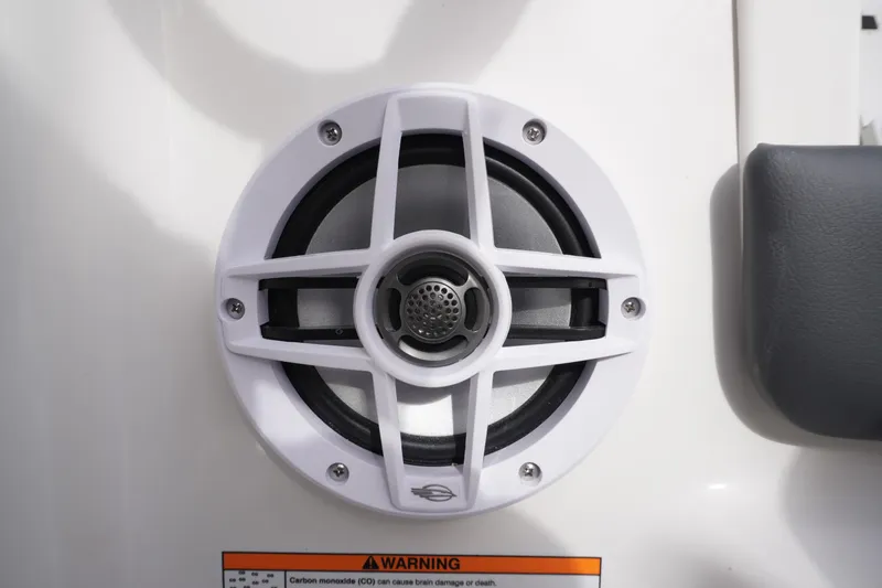 Slide: The Image of Speaker on 2026 Chaparral 21 SSi Ski & Fish boat with warning label visible. - 18