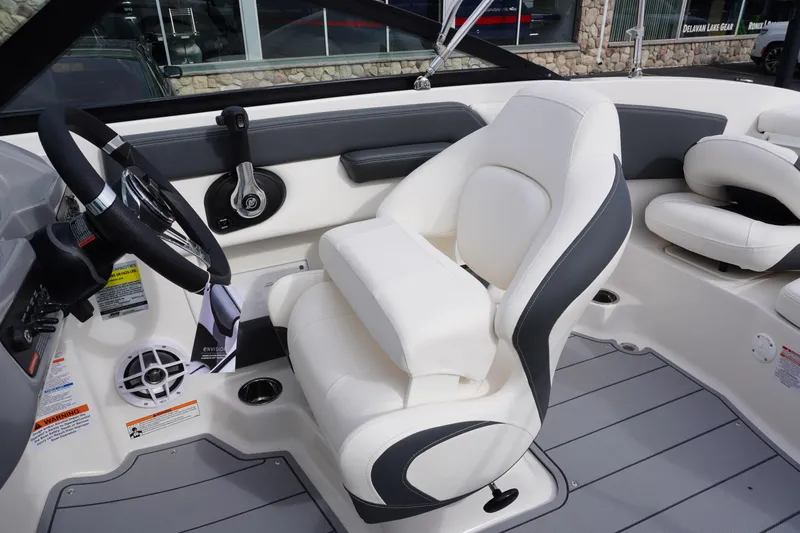 Slide: The Image of Interior of 2026 Chaparral 21 SSi Ski & Fish boat with white seating and steering wheel. - 20
