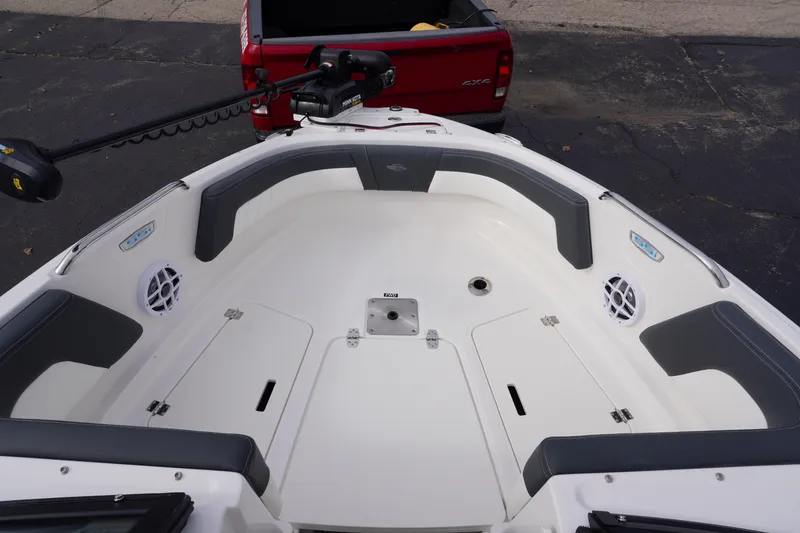 Slide: The Image of 2026 Chaparral 21 SSi Ski & Fish boat interior with seating and storage compartments. - 26