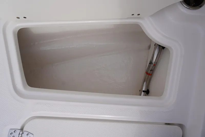 Slide: The Image of Storage compartment of 2026 Chaparral 21 SSi Ski & Fish boat, featuring sleek interior design. - 28