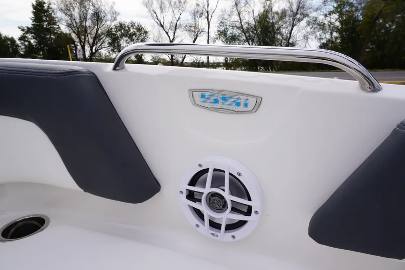 Slide: The Image of 2026 Chaparral 21 SSi Ski & Fish boat interior with speaker and logo detail. - 34