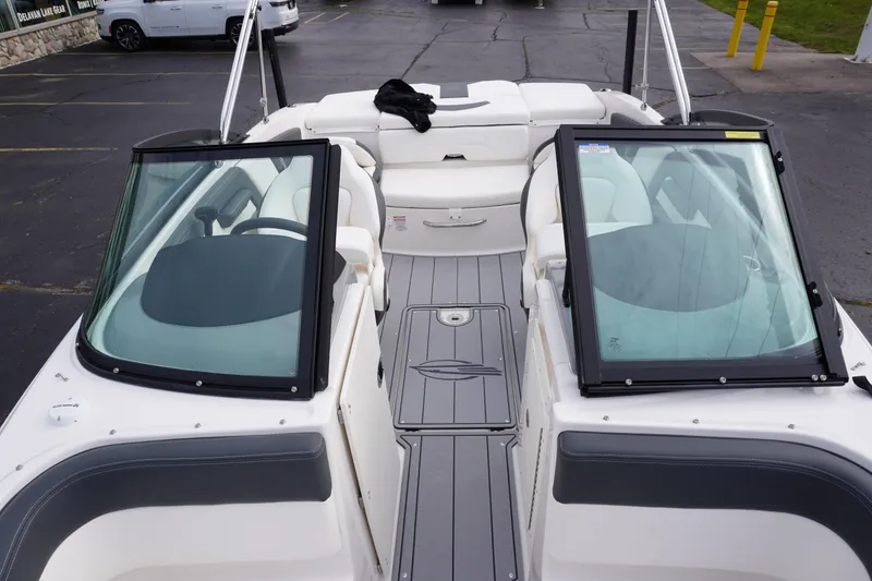Slide: The Image of 2026 Chaparral 21 SSi Ski & Fish boat interior with seating and windshield. - 36