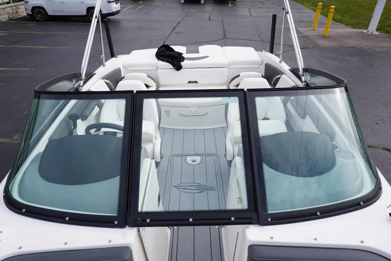 Slide: The Image of 2026 Chaparral 21 SSi Ski & Fish boat interior with seating and windshield view. - 37