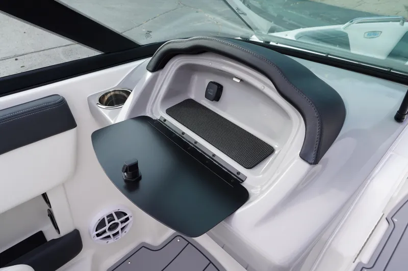 Slide: The Image of 2026 Chaparral 21 SSi Ski & Fish boat interior with storage compartment and speaker. - 40