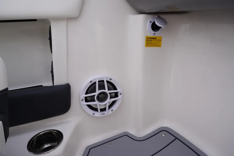 Slide: The Image of 2026 Chaparral 21 SSi Ski & Fish boat interior with speaker and cup holder. - 43