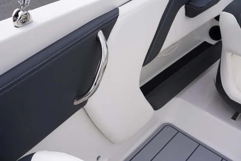 Slide: The Image of 2026 Chaparral 21 SSi Ski & Fish interior detail with sleek design and stainless steel handle. - 45