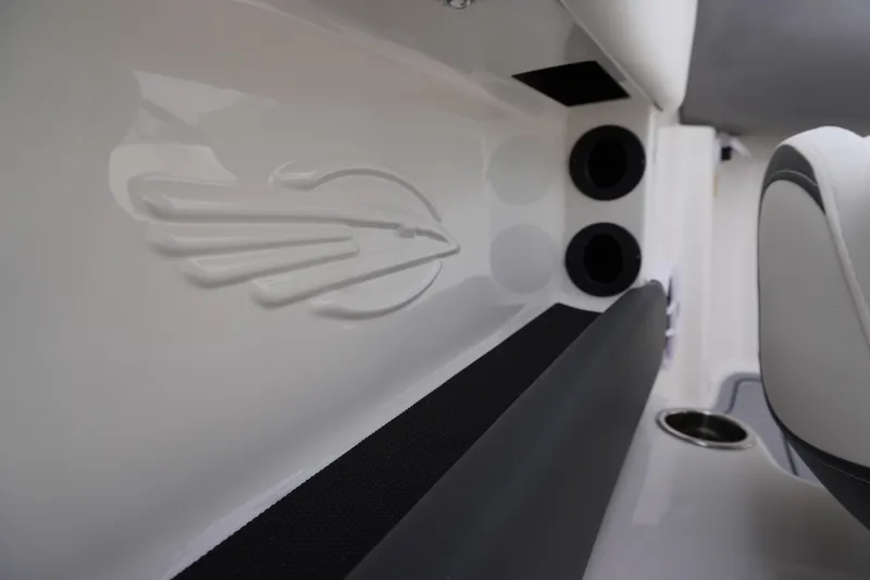 Slide: The Image of 2026 Chaparral 21 SSi Ski & Fish interior detail with logo and cup holder. - 47