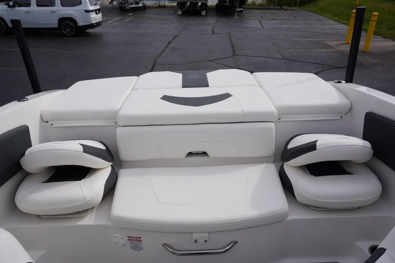 Slide: The Image of 2026 Chaparral 21 SSi Ski & Fish boat interior with white cushioned seating. - 49