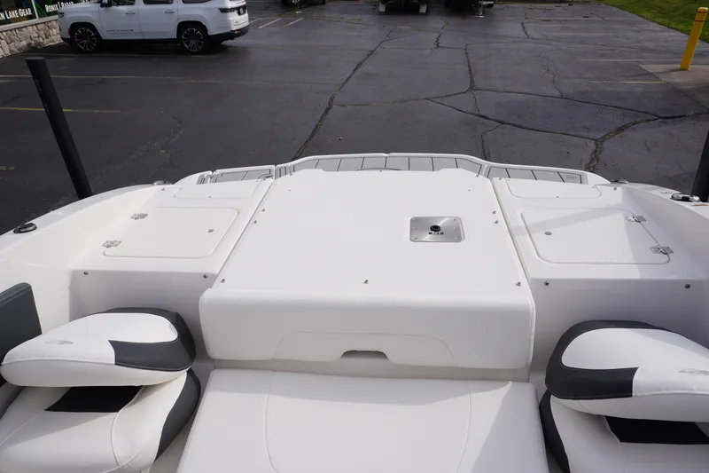 Slide: The Image of 2026 Chaparral 21 SSi Ski & Fish boat interior with seating and storage compartments. - 54