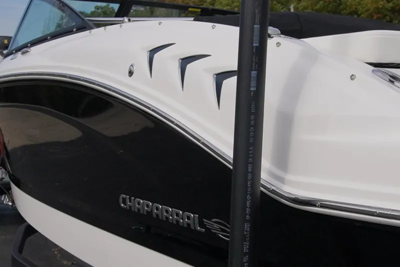 Slide: The Image of 2026 Chaparral 21 SSi Ski & Fish boat, sleek black and white design. - 6