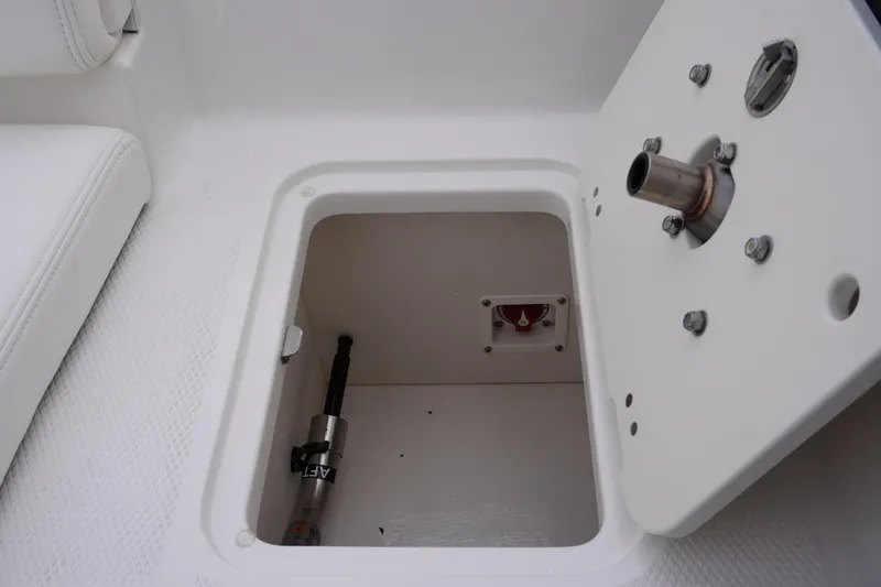 Slide: The Image of Open storage compartment on 2026 Chaparral 21 SSi Ski & Fish boat. - 60