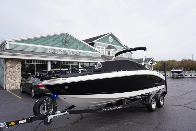 Slide: The Image of 2026 Chaparral 21 SSi Ski & Fish boat on trailer at Reed's Marine dealership. - 62