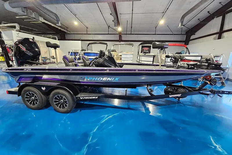 The Image of 2026 Phoenix 721 ZXL boat displayed indoors on a blue floor. - 1