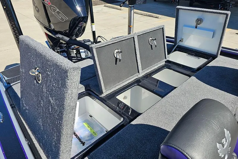 Slide: The Image of 2026 Phoenix 721 ZXL boat with open storage compartments and motor, showcasing interior features. - 20
