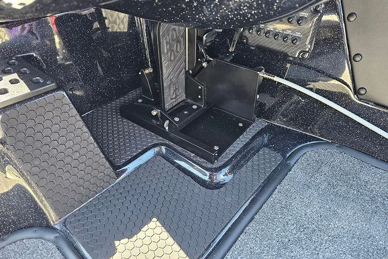 Slide: The Image of Interior view of 2026 Phoenix 721 ZXL boat, featuring foot pedal and textured flooring. - 23