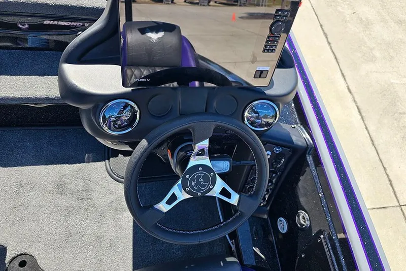 Slide: The Image of 2026 Phoenix 721 ZXL boat dashboard with steering wheel and control panel. - 24