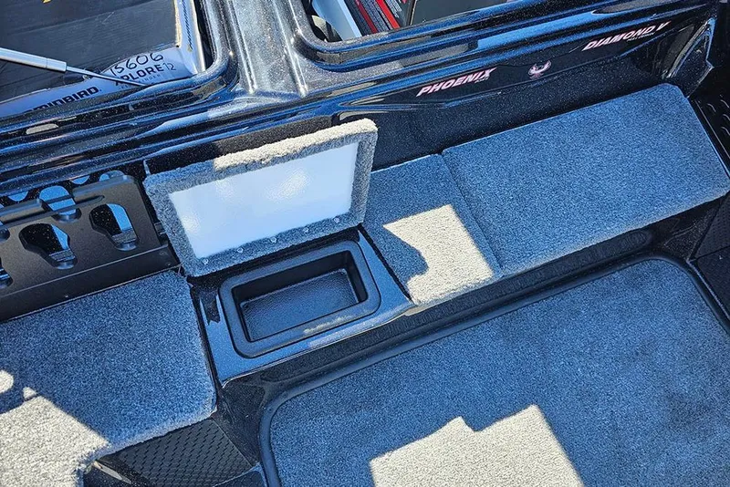Slide: The Image of 2026 Phoenix 721 ZXL boat interior with carpeted flooring and storage compartments. - 30