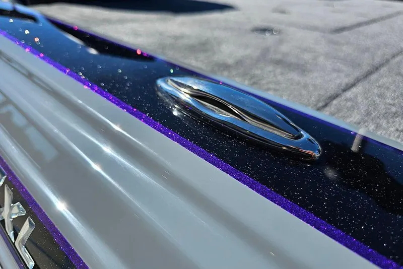 Slide: The Image of Close-up of 2026 Phoenix 721 ZXL boat with metallic finish and sleek design. - 36