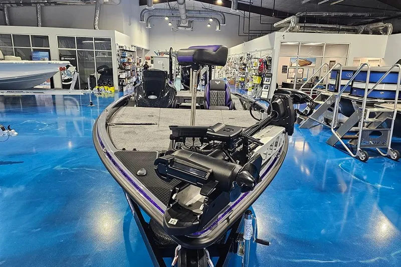 Slide: The Image of 2026 Phoenix 721 ZXL boat displayed in a showroom with blue flooring. - 4