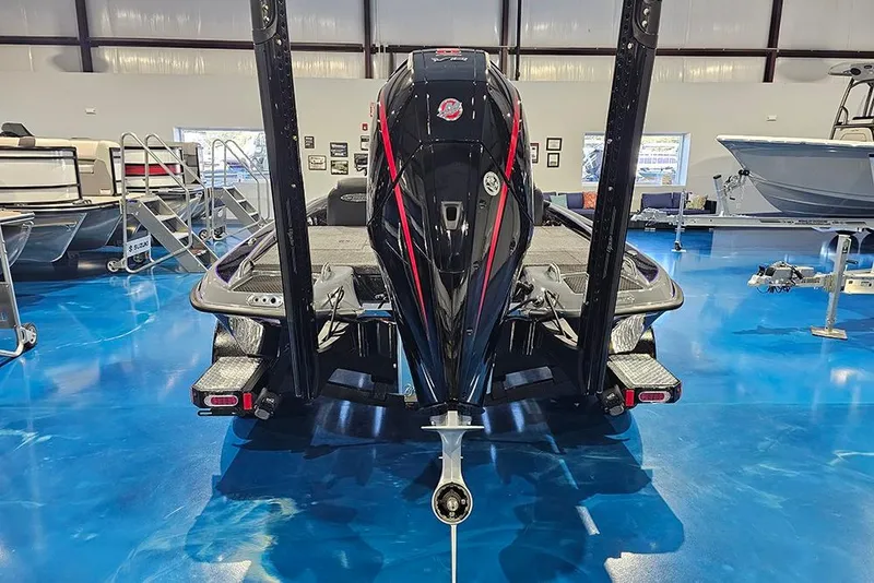 Slide: The Image of 2026 Phoenix 721 ZXL boat in showroom, rear view, blue floor. - 8