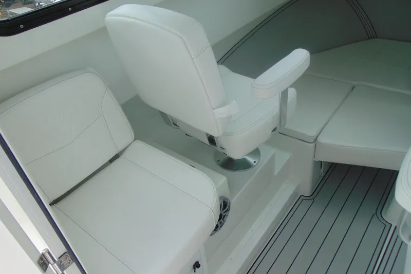 Slide: The Image of Interior of 2026 Parker 227 Explorer boat with white seating and modern design. - 15