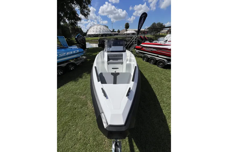 Slide: The Image of 2026 Iron 707 boat displayed outdoors, surrounded by other boats under a blue sky. - 3