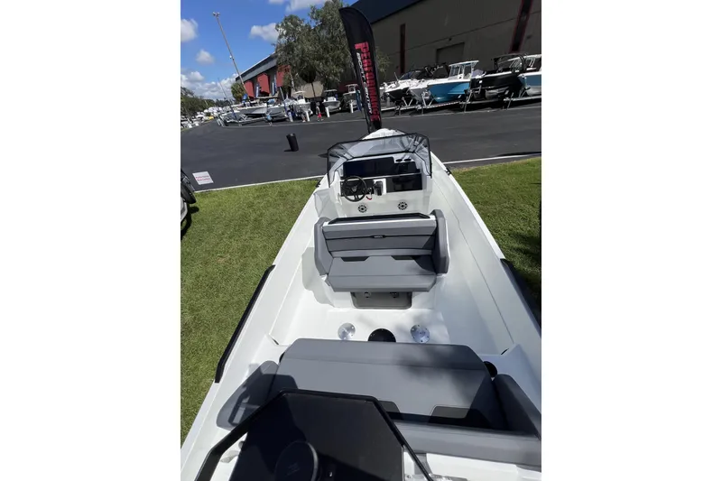 Slide: The Image of Modern Iron 707 boat interior, 2026 model, displayed outdoors with seating and control panel. - 5