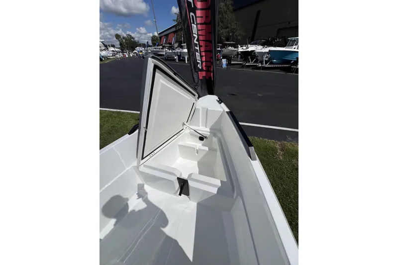 Slide: The Image of Open storage compartment on Iron 707 boat, 2026 model, displayed outdoors. - 9