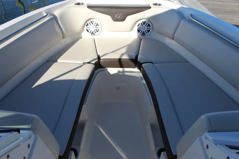 Slide: The Image of 2024 Sailfish 226DC boat interior with cushioned seating and speakers. - 25