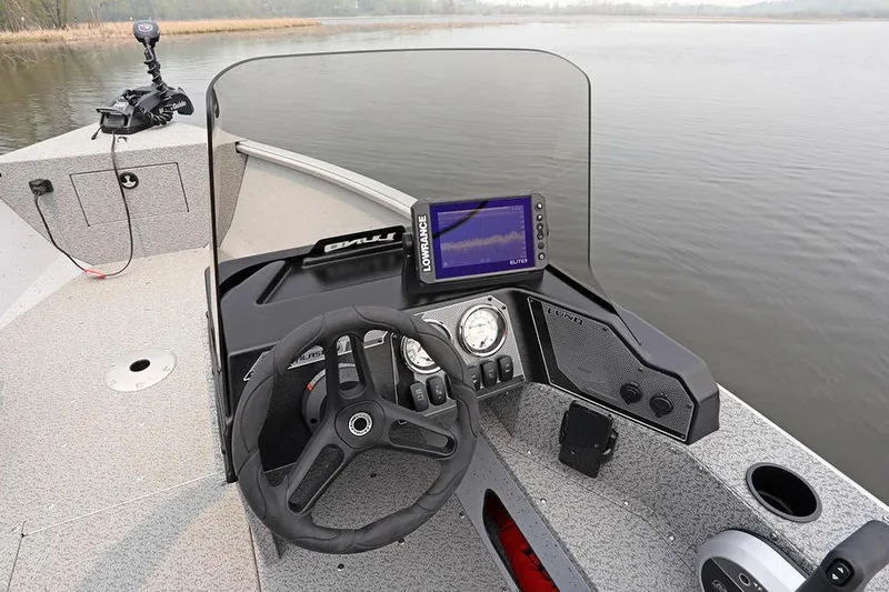 Slide: The Image of Manufacturer Provided Image: 2024 Lund 1675 Alaskan SS boat dashboard with steering wheel and fish finder. - 17