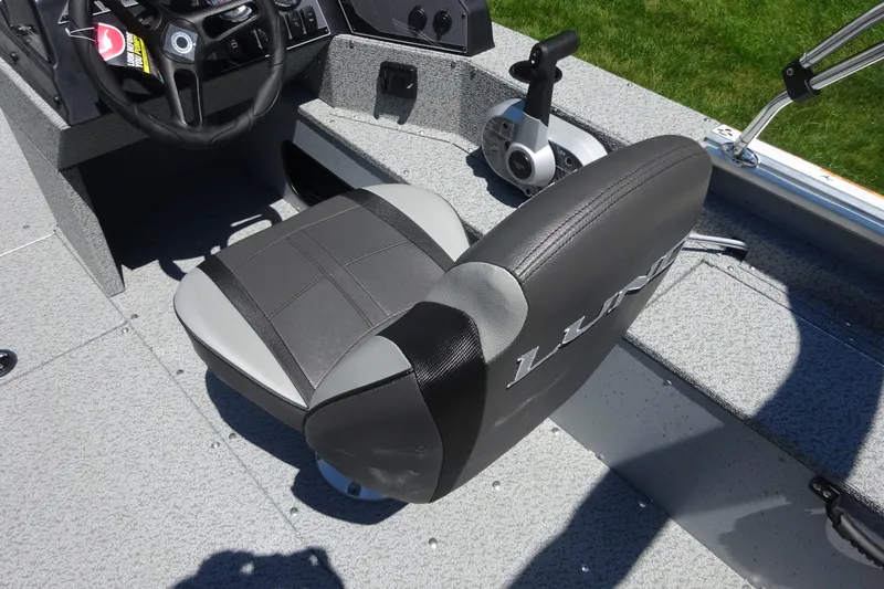 Slide: The Image of 2024 Lund 1675 Alaskan SS boat interior with steering wheel and seat. - 3