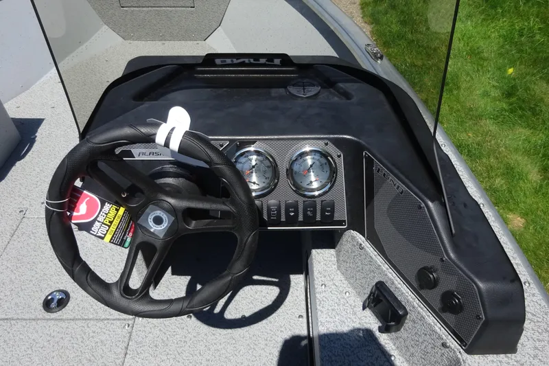 Slide: The Image of 2024 Lund 1675 Alaskan SS boat dashboard with steering wheel and gauges. - 8