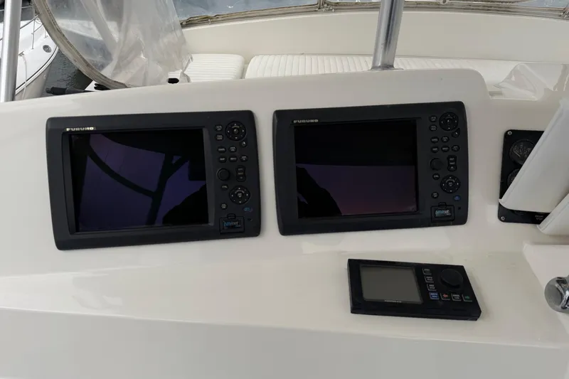 Slide: The Image of Control panel of a 2001 Egg Harbor 42 SportYacht with navigation screens. - 11