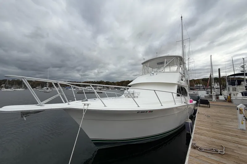 Slide: The Image of 2001 Egg Harbor 42 SportYacht docked at marina under cloudy skies. - 14