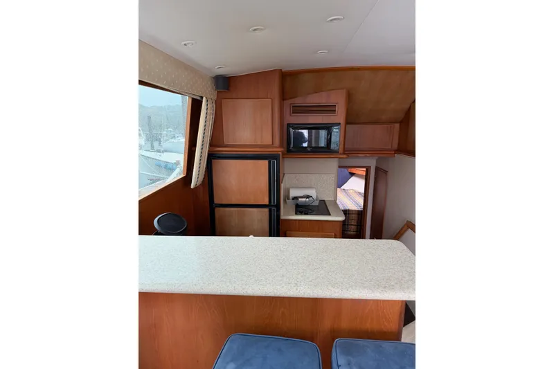 Slide: The Image of Interior of 2001 Egg Harbor 42 SportYacht with kitchen and seating area. - 17