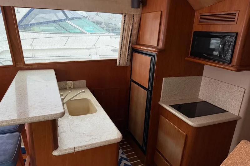 Slide: The Image of Interior of 2001 Egg Harbor 42 SportYacht kitchen with sink, stove, and microwave. - 19