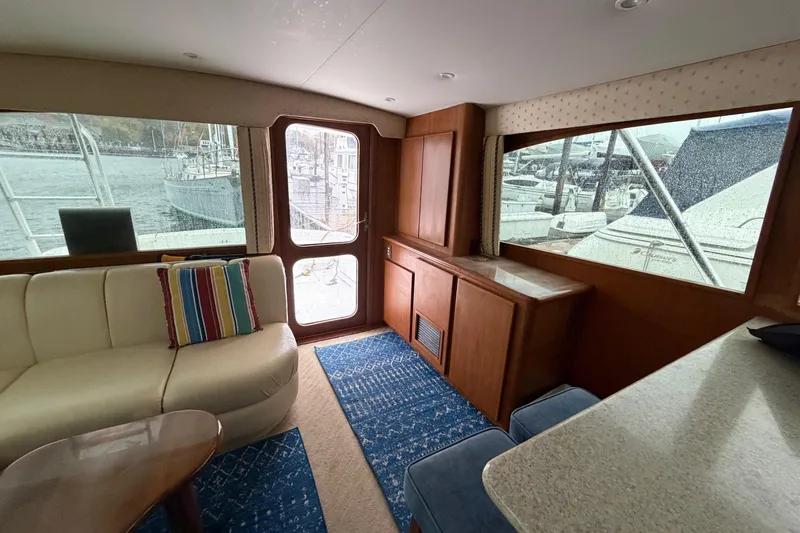 Slide: The Image of Interior of 2001 Egg Harbor 42 SportYacht with cozy seating and large windows. - 20